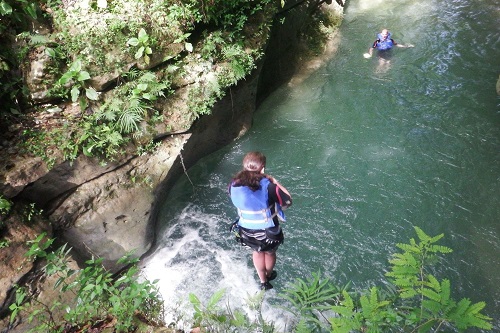 Just J jumping a small waterfall